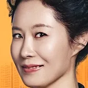 Moon So-Ri portraying Jang Suk-Jin