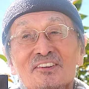 Tsutomu Yamazaki portraying Tsutomu Ishida